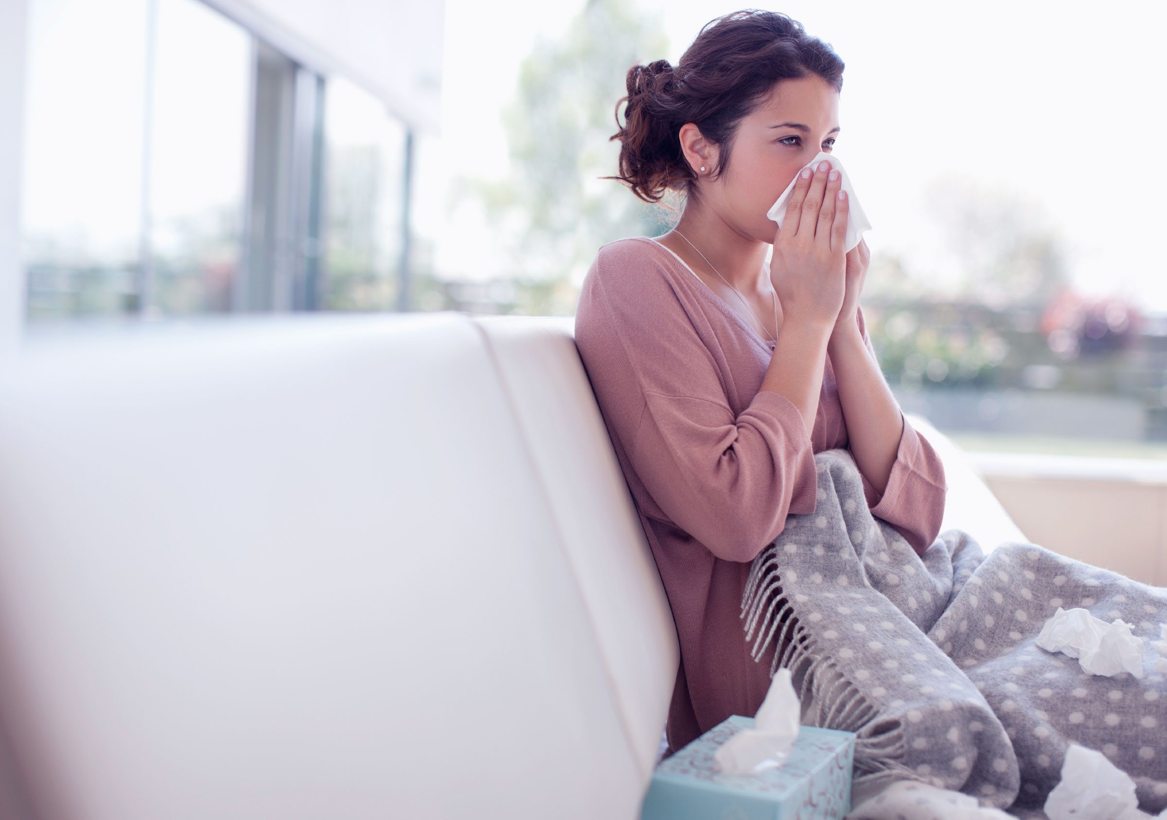 woman blowing her nose
