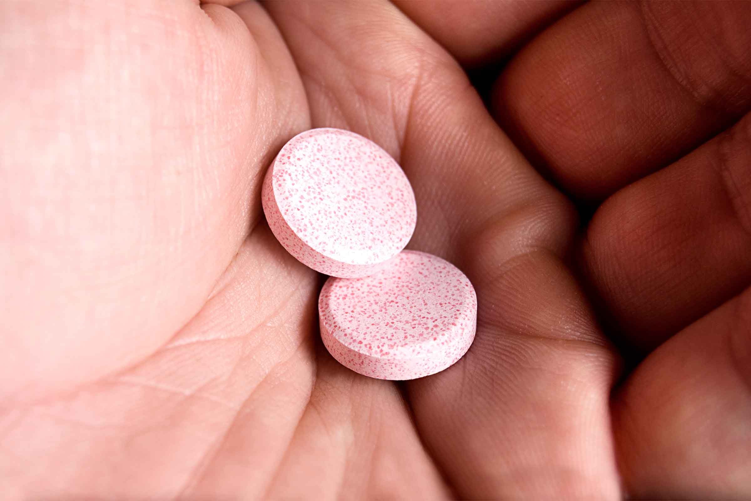 Hand holding antacids