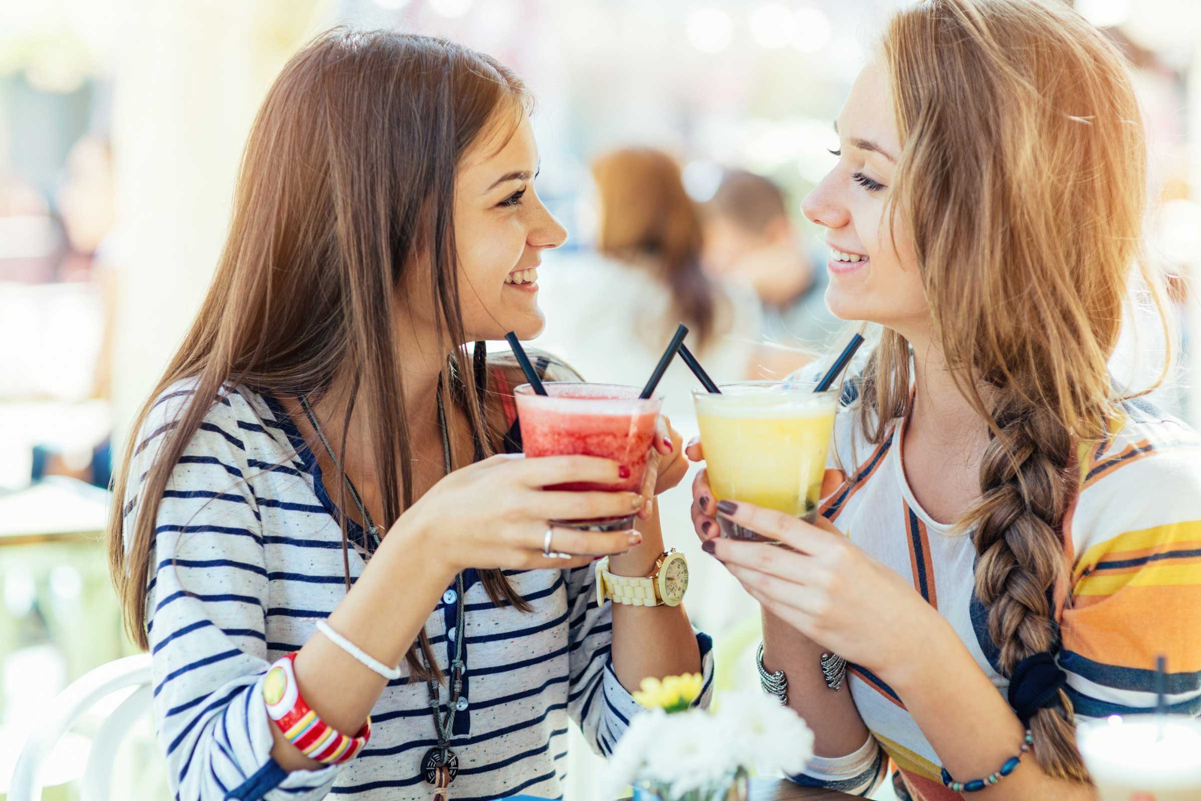 two women having smoothies 