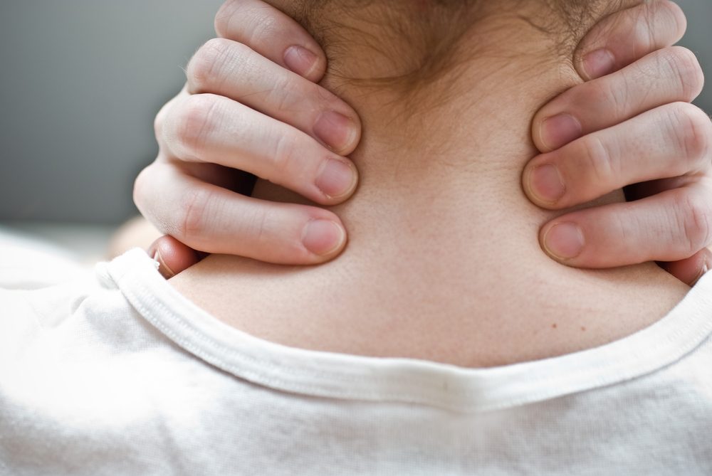 Woman has neck pain