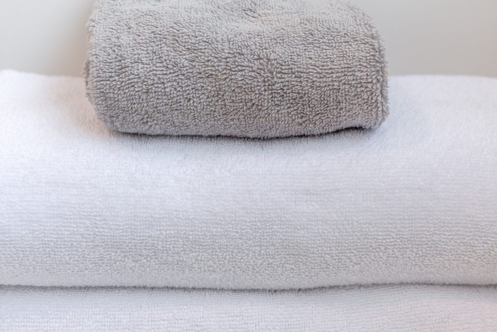 White and gray folded towels extreme closeup