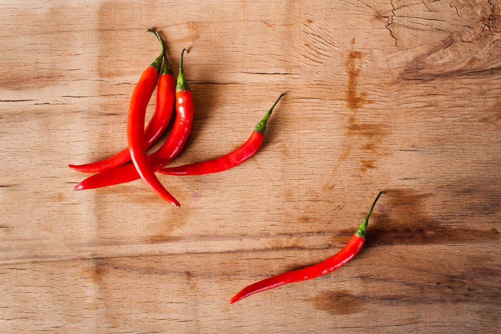 Chilli pepper close up on wood desk