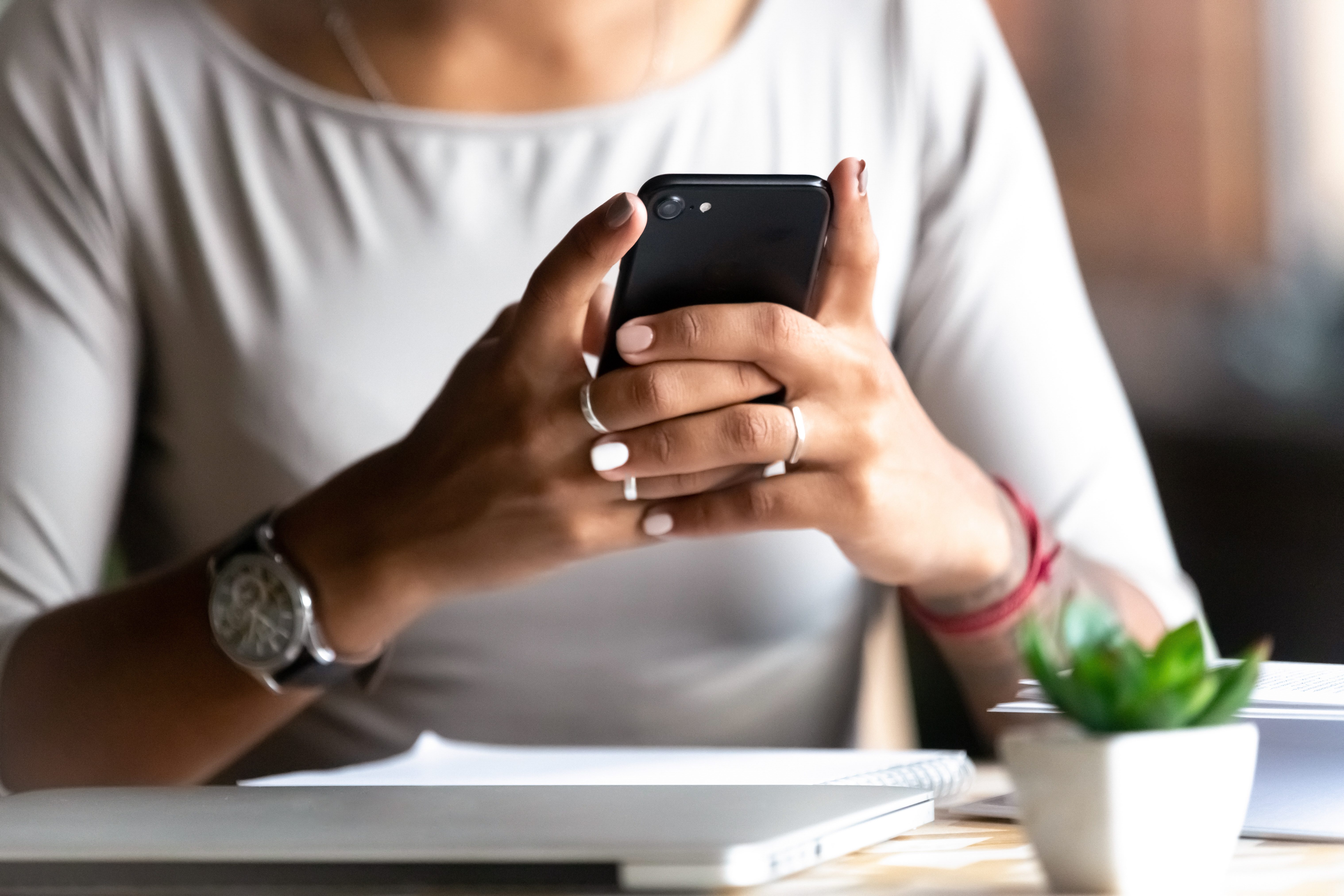 Close up woman holding smartphone