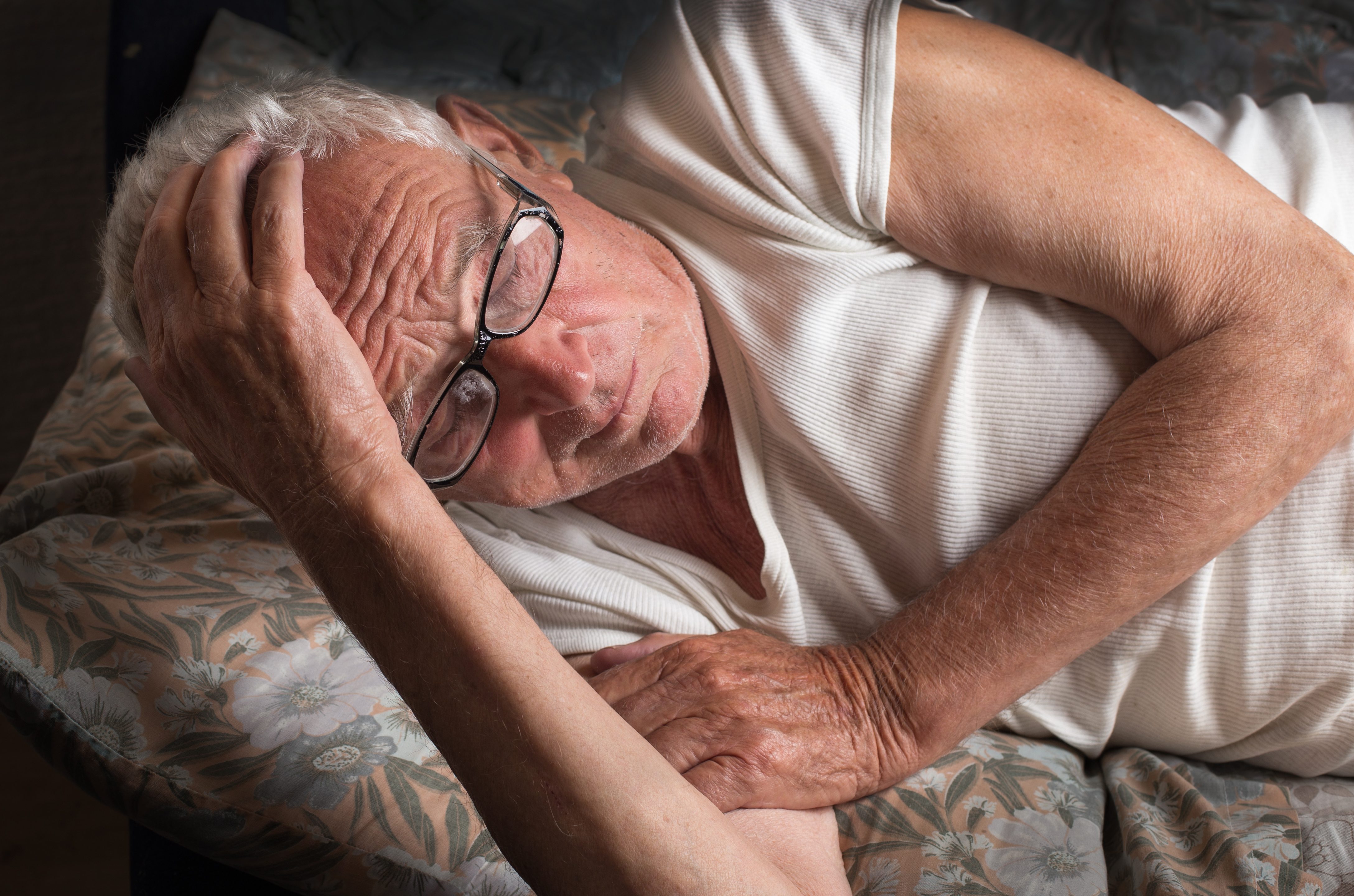 Senior man laying down