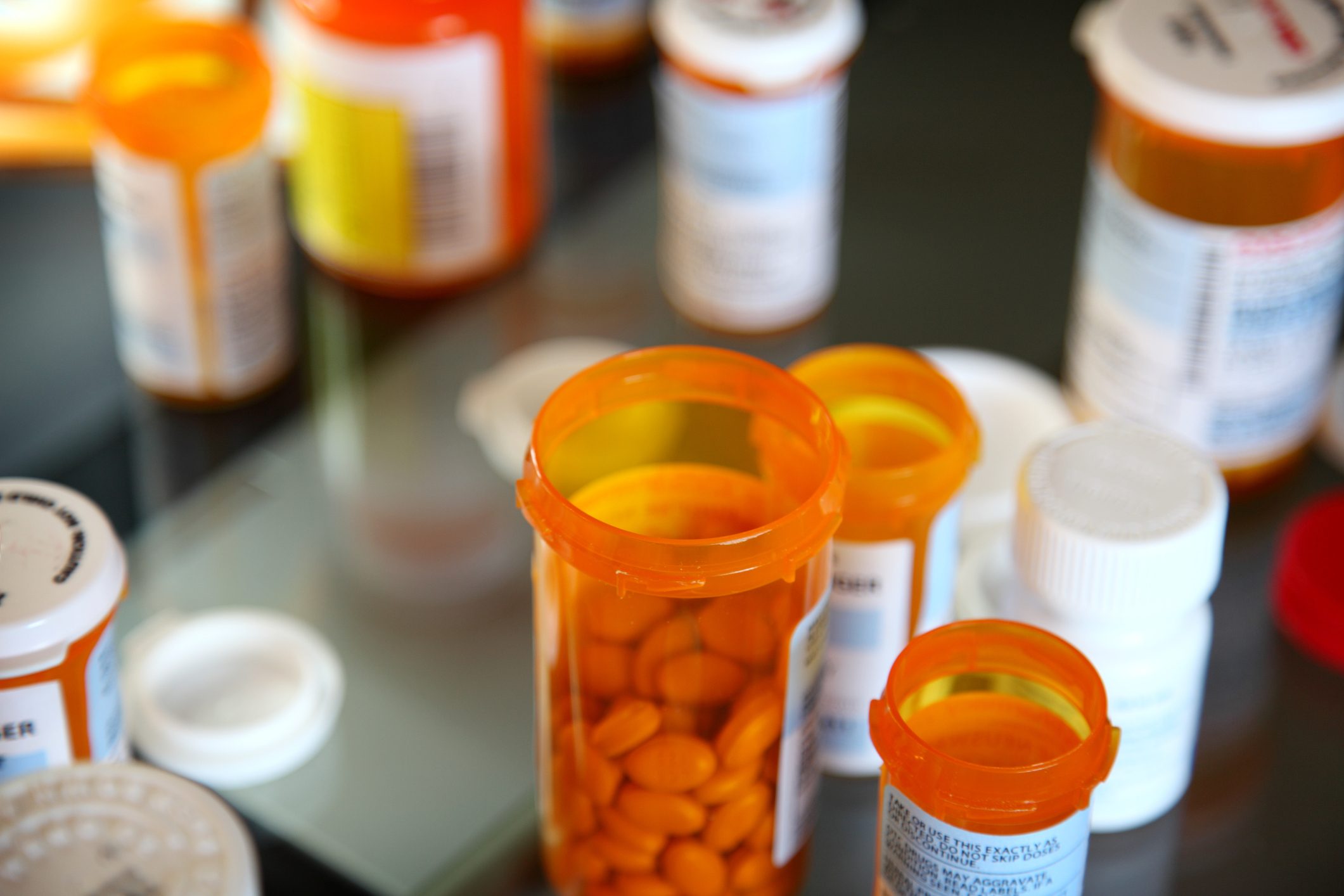 various pill bottles on counter