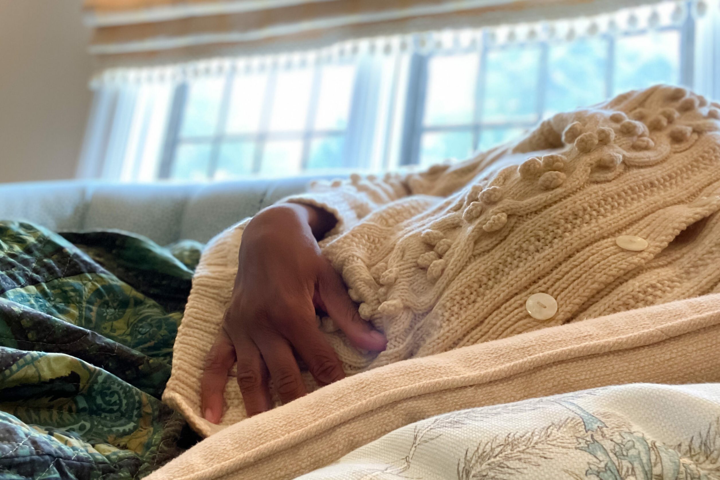 african-american woman experiences stomach pain