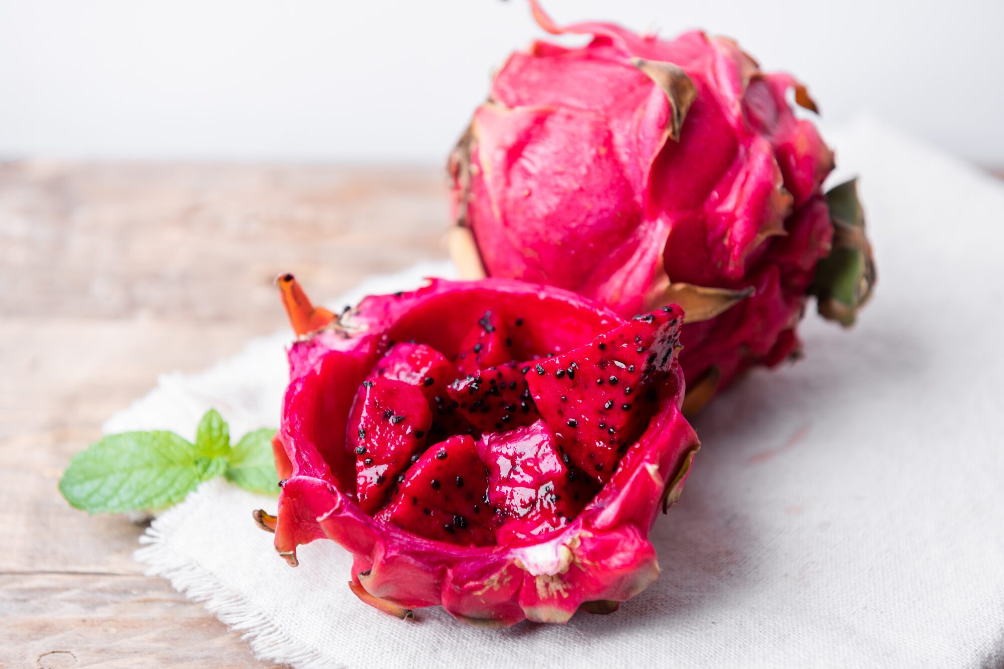 Red Dragon fruit (Pitaya) cut pieces cubes close up