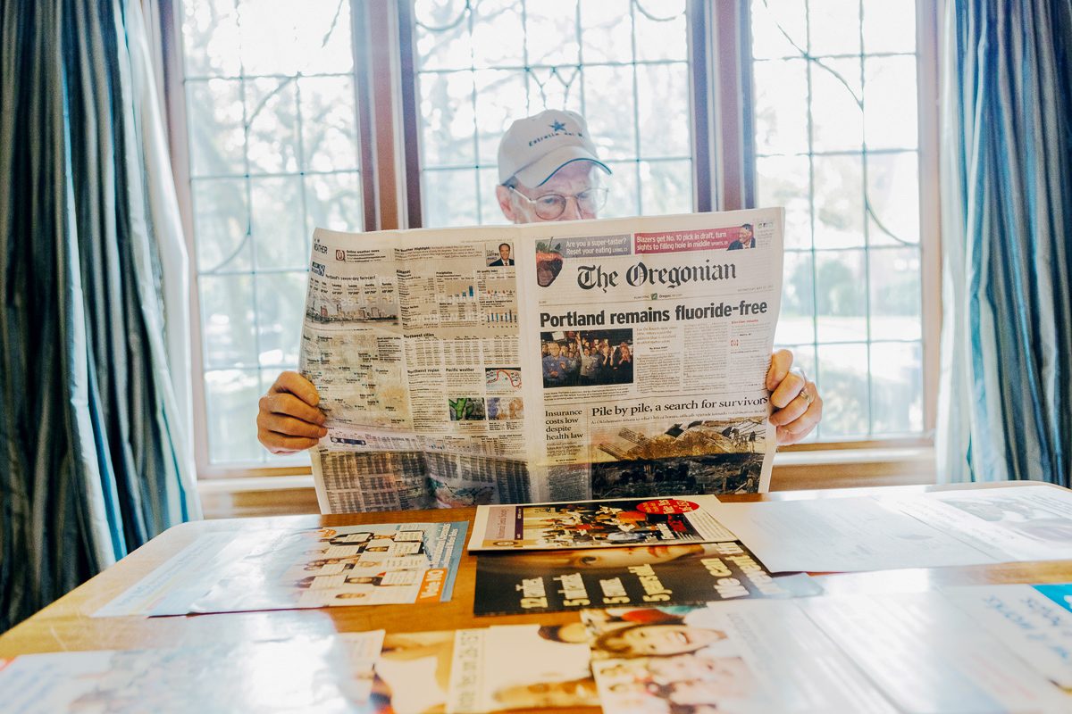Kurt Ferré, a longtime pro fluoride activist and retired dentist, showing a collection of newspaper stories about the failed fluoridation campaign in Portland