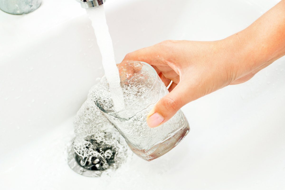 filling glass with tap water